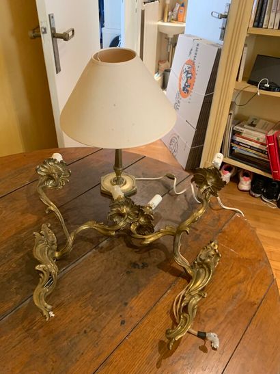 A pair of wall lamps of rocaille style in...