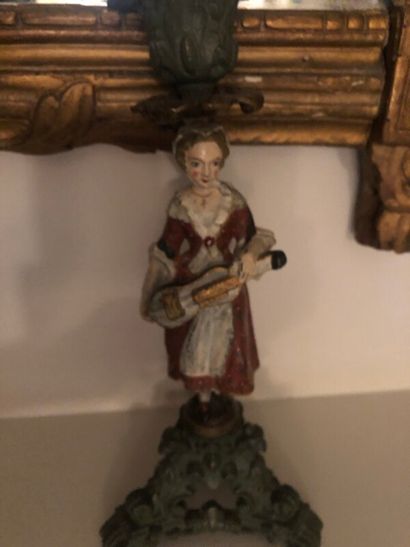 Pair of polychrome candlesticks representing...