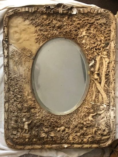 Frame in composition or paste decorated with...