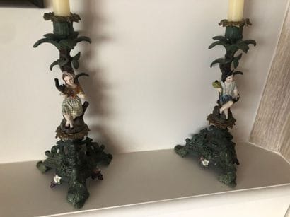 Pair of candlesticks in painted sheet metal...