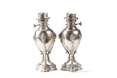 PAIR OF PETROLEUM LAMPS in the form of silver...