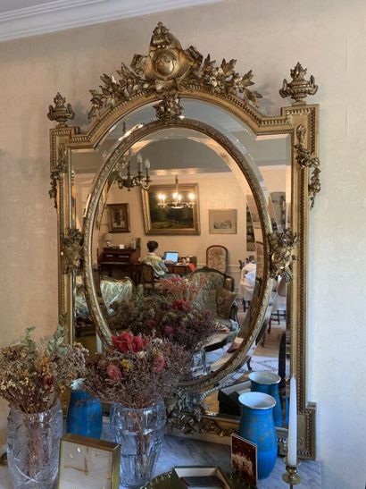 Large carved and gilded wood mirror with...