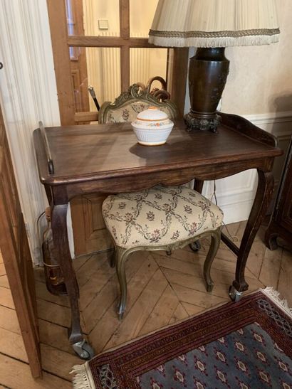 Set of four nesting tables, the tops decorated...