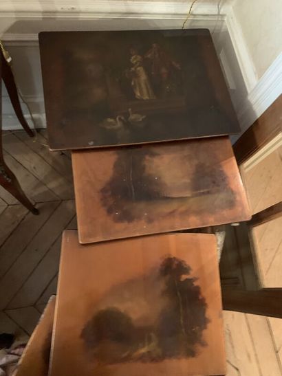 Set of four nesting tables, the tops decorated...