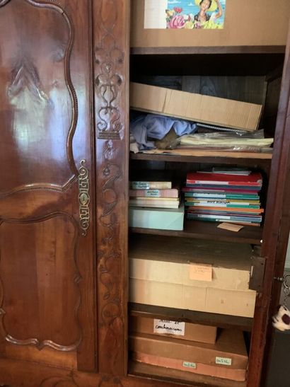 Carved wood cabinet opening with two doors,...