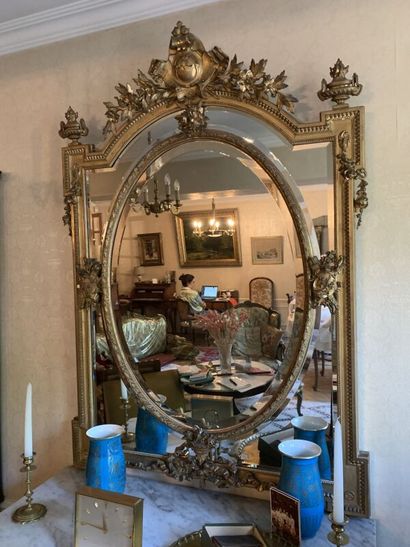 Large carved and gilded wood mirror with...