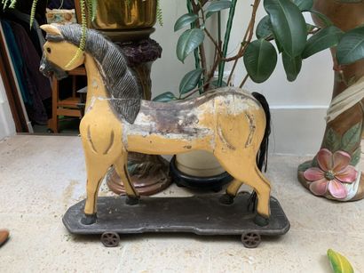 Painted wooden horse on wheels. Height: 76...