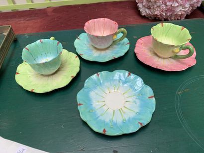 Three enameled earthenware cups and 4 saucers...