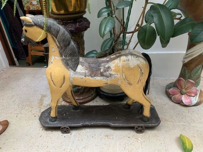 Painted wooden horse on wheels. Height: 76...