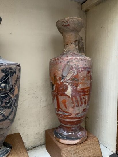 Lot of small terracotta statuettes and vases....