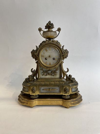 Gilt bronze clock and pair of candlesticks,...