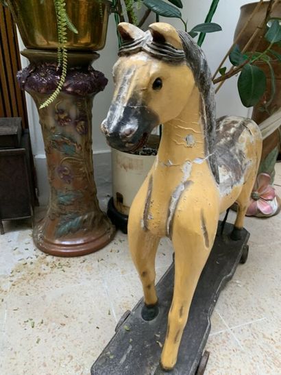 Painted wooden horse on wheels. Height: 76...