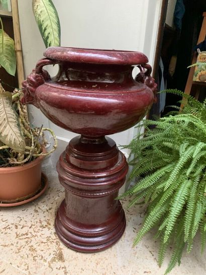 Red earthenware planter on base, handle with...