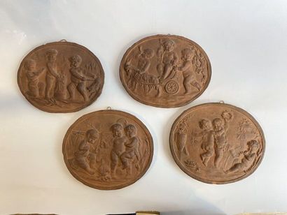 Six terracotta medallions with stamped putti...