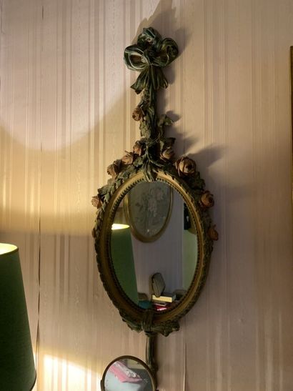 Oval polychrome painted wood mirror. 
79...
