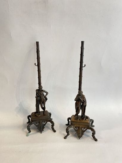 Pair of patinated bronze torches decorated...