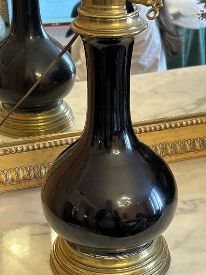 Pair of black porcelain oil lamps