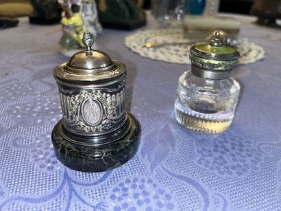 Two silver inkwells 
One on a marble base...