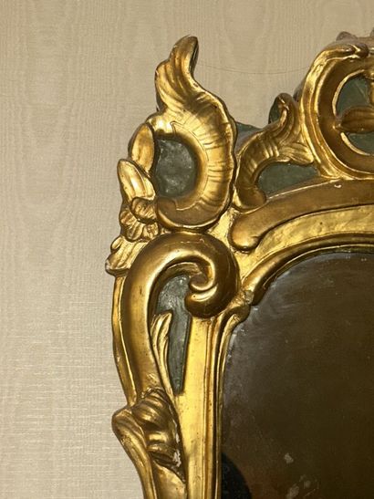 Gilded wood mirror on green patina background...