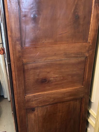 Walnut cabinet, molded and carved with flowers,...
