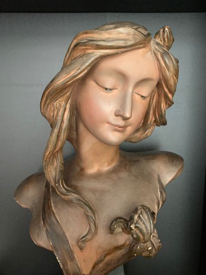 Female bust in patinated plaster.
Illegible...