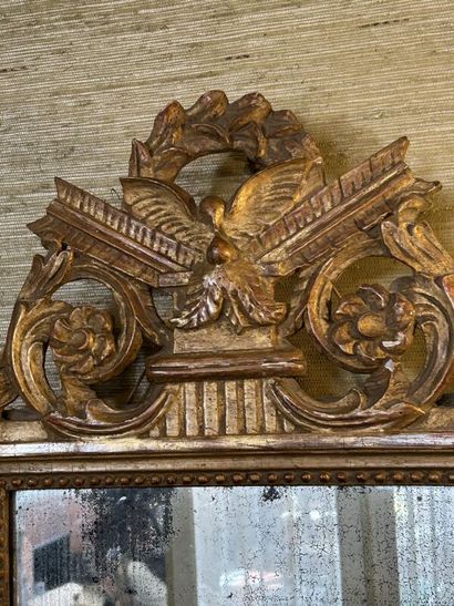 Gilded wood mirror with pearl frieze, 
stylized...