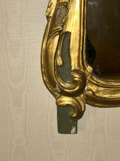 Gilded wood mirror on green patina background...
