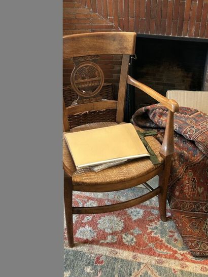 Rustic straw-covered armchair in natural...