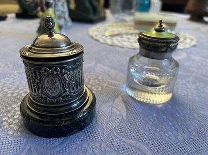 Two silver inkwells 
One on a marble base...