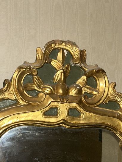 Gilded wood mirror on green patina background...