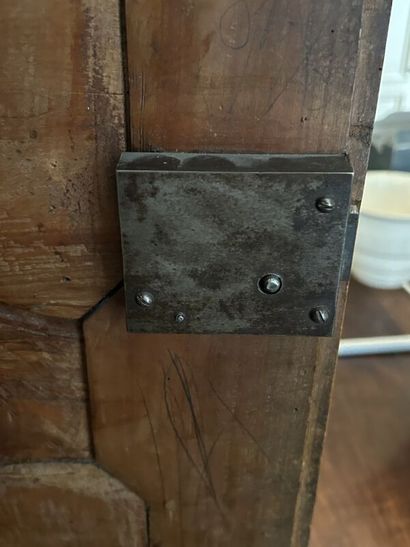 Walnut cabinet, molded and carved with flowers,...