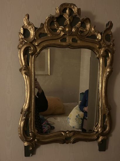 Gilded wood mirror on green patina background...