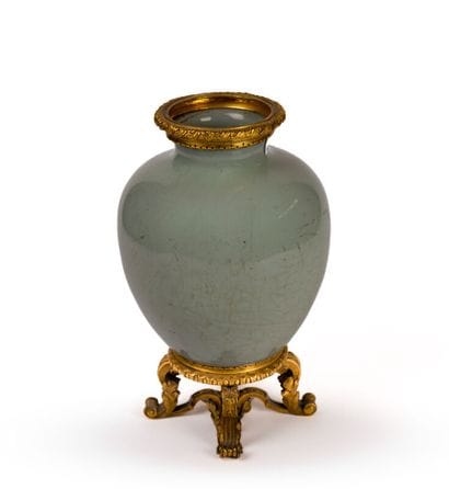 A celadon porcelain vase with a crackled...