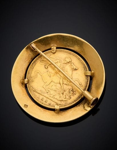 BROCHE circulaire en or jaune (750 ‰) serti...