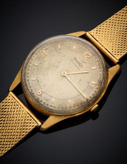 BRACELET MONTRE ronde d'homme en or jaune...