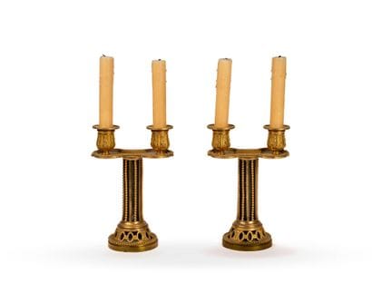 Pair of small two-arm candelabra in chiseled...