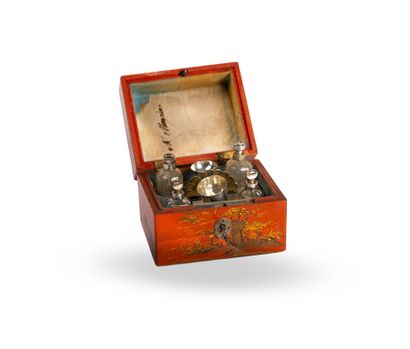A red-and-gold lacquered wooden perfume set...
