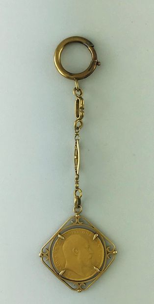 Gold key ring 750°/°° decorated with a sovereign...