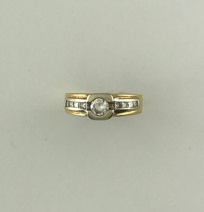 Ring in two golds 750°/°° set with a diamond...