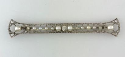 A white gold and platinum openwork brooch...