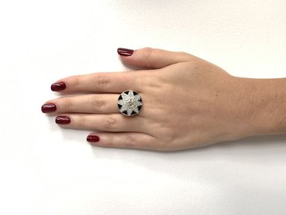 BAGUE en or et or gris, onyx et diamants
Gold...