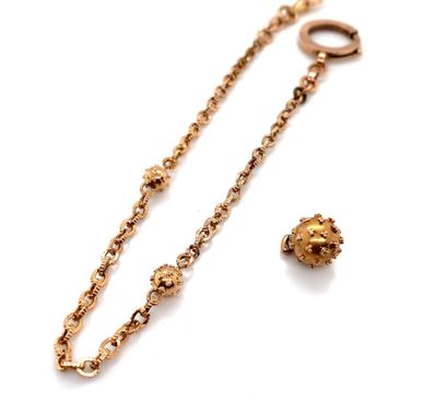 GOLD WATCH CHAIN (750‰).
Attached is a gold...