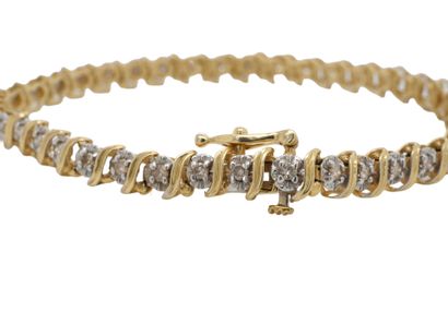 BRACELET en or, diamants.
BRACELET ligne...
