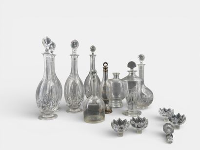 Important lot of glass and cut crystal decanters.

Attached...
