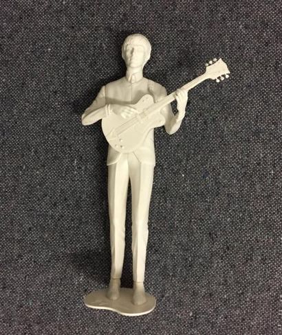 George Harrison : Little white plastic statue,...