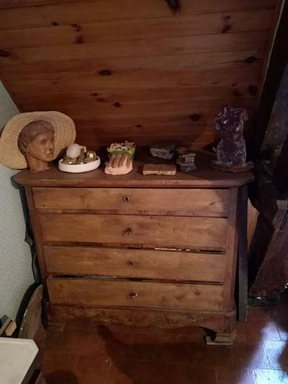 Natural wood chest of drawers with four drawers....
