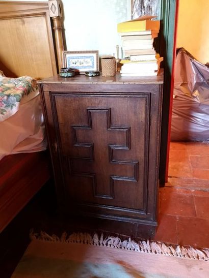 Moulded natural wood bedside table decorated...