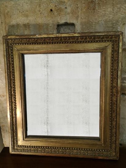Miroir rectangulaire de style Louis XVI,...