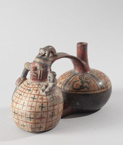 Vase à double panse représentant un dignitaire

Vêtu...