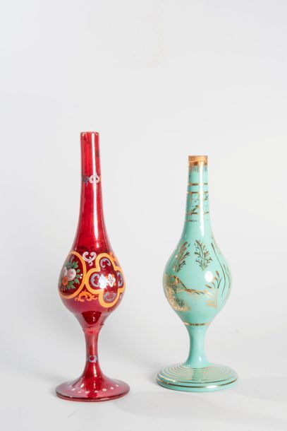 Deux aspersoirs en verre à décor émaillé,...